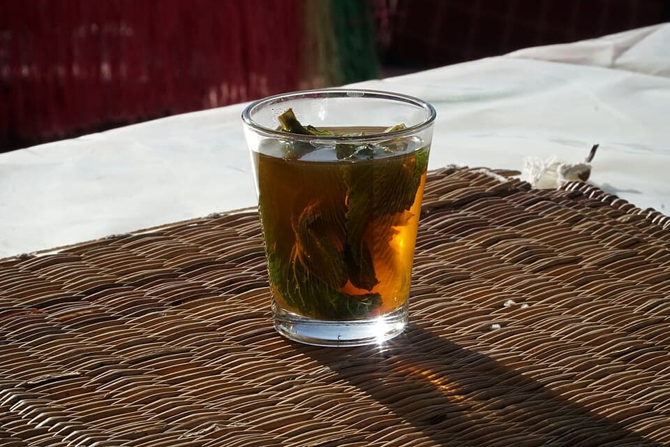 A glass of Moroccan mint tea in the sun